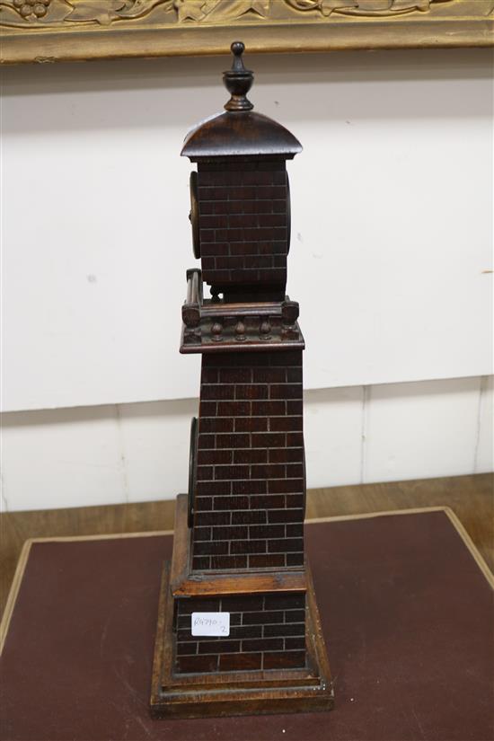 A late Victorian carved oak Lighthouse  clock barometer by Frank Flower of St James